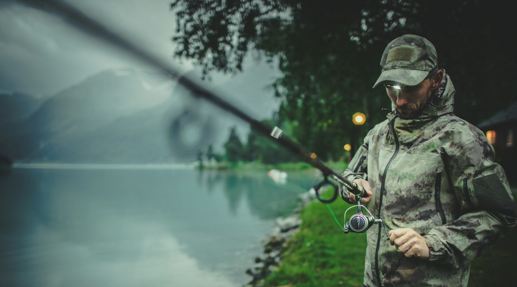 Men Preparing Rod For Late Evening Fishing